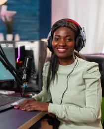A presenter recording in a studio